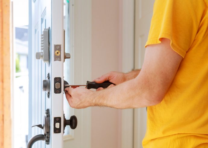 worker-installing-or-repairing-new-lock-handyman-repair-the-door-lock.jpg